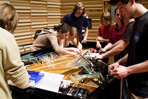 students preparing piano